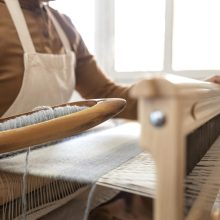person-working-embroidery-workshop